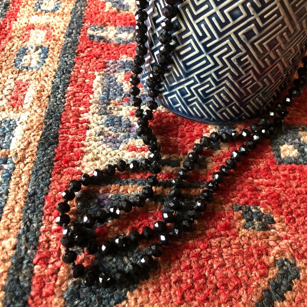 Black shiny glass beaded necklace. 28 inches